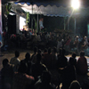 people gather to watch an all night performance by Dhalang Ki Anom Dwijo Kangko.  Today, audienced most commonly watch the performance from the dhalang's side of the screen.  Solo, Central Java, 2009.  Photograph by Felicia Katz-Harris.
