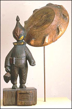 E. Padilla, alien with flying saucer